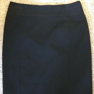Black pencil skirt with black button detail